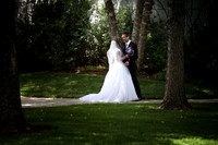 Bride and groom walking below the boston, ma LDS temple